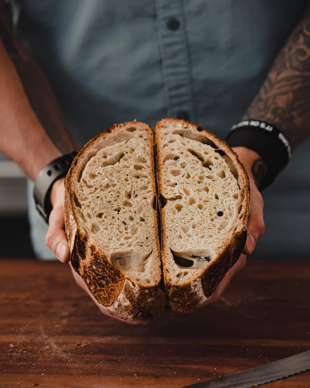Fresh sourdough split open in the chef’s hands