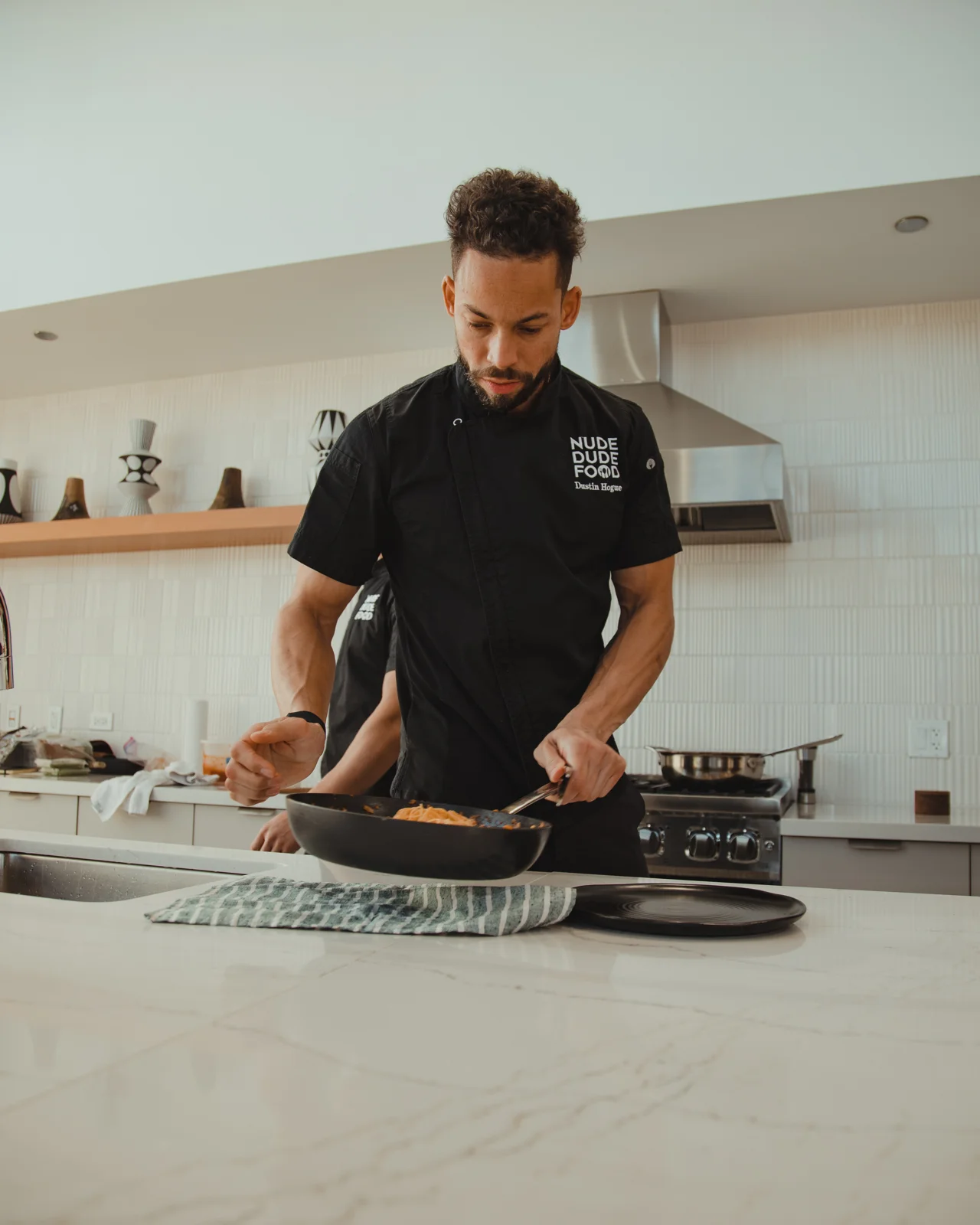 An NDF chef cooking in a home kitchen