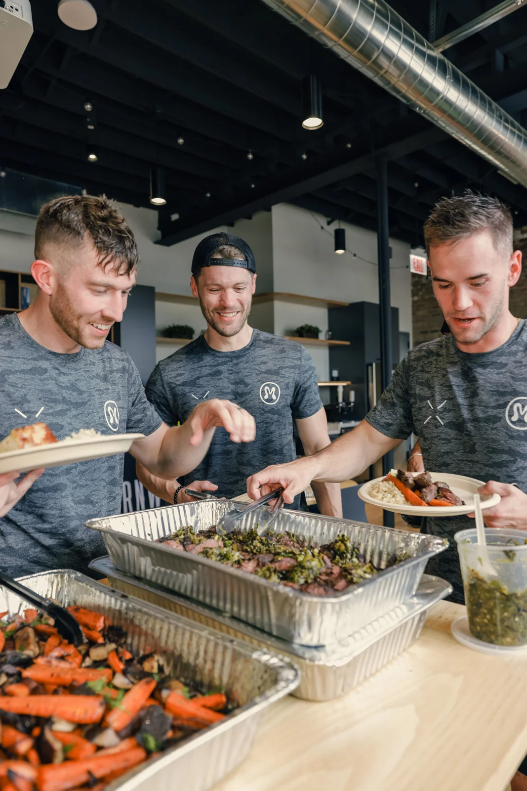 NDF chefs plating food together in the kitchen