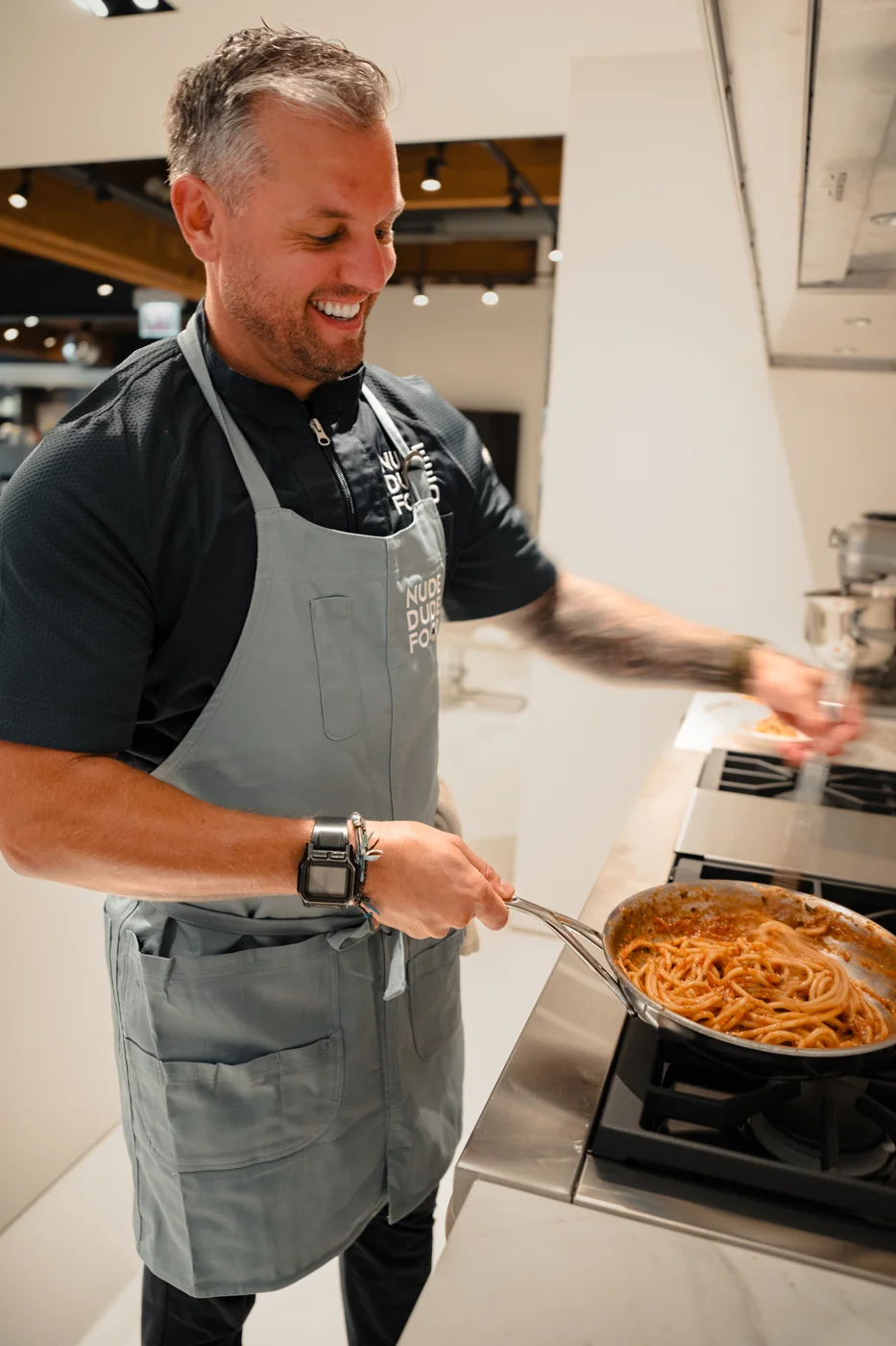 An NDF chef cooking at the stove